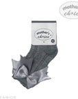 Gray knee-high socks with a bow on a white background, featuring 'mother's choice' branding.