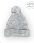 Gray knit beanie with pom-pom on a white background, featuring 'mother's choice' branding.