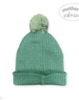 Green knit beanie with pom-pom on a white background, featuring 'Mother's Choice' branding.