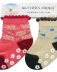 Two pairs of baby socks with floral patterns on a 'Mother's Choice' branded card.