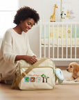 Mothers Choice Little Friends Daypack Beige, a cream-colored diaper bag with plaid accents and embroidered birds and trees.
