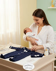 Mother's Choice navy blue sailor romper set for infant boys, featuring a white collar and bow. Includes a matching hat and a cream elephant-embroidered cardigan.