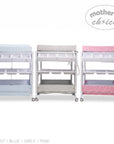 Stork And Baby baby bath caddy set in blue, grey, and pink with star patterns, storage shelves, and wheels.