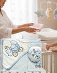 Stork And Baby 3 piece baby bath set with hooded towel, sponge, and facecloth, embroidered with blue baby carriage.