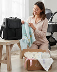 Stork And Baby black PU upper baby bottle warmer bag with insulated design for travel and outings.