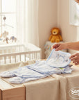 Stork And Baby blue 5-piece 100% cotton baby grower set with stars and stripes pattern and a bib.