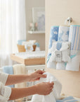 Stork And Baby blue elephant hooded towels and facecloths set for baby care. Soft, absorbent cotton.