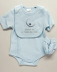 Stork And Baby light blue polka dot baby boy romper with a crescent moon and star bib that says "Bright as a Twinkling Star".