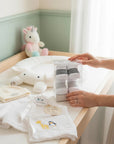 Stork And Baby boys 2 pack white socks with grey stripes, presented in a clear gift box.