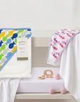 Stork And Baby 100% cotton hooded towel with playful sea creature designs in pink seahorse and blue fish patterns.