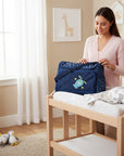 Stork And Baby navy blue square diaper bag with 'Up Up And Away' airplane design and organized compartments.
