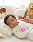 Stork And Baby infant girls light green bib with purple trim, embroidered flower and