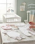 Stork And Baby Mothers Choice 5 Piece Starter Packs Flowers: babygrow, bodysuit, bib, hat, mittens in floral print.
