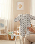 Stork And Baby grey quilted baby growsuit with rainbow and cloud print, long sleeves, footed design, and zipper closure.
