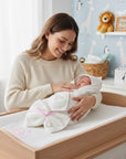 Stork And Baby white hooded towel and facecloth set with pink trim and 'Hello Baby' embroidery, tied with a pink bow.