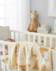 Stork And Baby beige and white polyester mink infant cutwork blanket with giraffe pattern