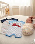 Stork and Baby infant's 2-pack cotton blend rompers: one grey with baseballs and 'All-Star' print, one white with blue pinstripes and 'Mommy's All-Star' graphic.