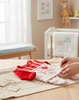 Stork And Baby red and white polka dot velour 2-piece infant grower set with "Mummy's Little Twinkle Toes" embroidery and heart detail.