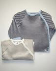 Stork And Baby infants cardigans, 2 pack. One brown and light blue striped, one beige and white striped.
