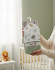 Stork And Baby hooded bath towel in mint art design, made of 100% cotton, with stars and leaf prints.