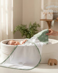 Stork And Baby Mothers Choice sage green bamboo hooded towel with leaf print, 75x75cm, for babies.