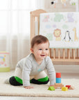 Stork And Baby Mothers Choice Knee Guards in green and navy, designed for crawling babies.