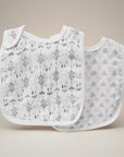 Stork And Baby 2 pack white muslin bibs with grey and pink arrows and geometric patterns.