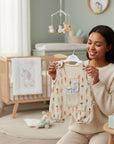 Stork And Baby beige muslin romper with carrot print and bunny ear pocket detail. Shortalls for baby boys.
