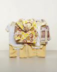 Stork And Baby 3 piece neutral hooded baby set with white bodysuits, yellow pants, and patterned fleece jackets.