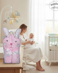 Stork And Baby pink 100% cotton baby hooded towel with bunny ears and face, tied with a ribbon.