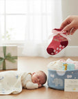 Stork And Baby pink floral baby socks with non-slip grip and pink ribbon detail