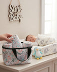 Stork And Baby insulated bottle warmer bag with pink flowers design, perfect for travel and outings.