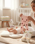 Stork And Baby pink baby tights with ladybug pattern, soft stretchy fit for all-day wear.