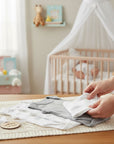 Stork And Baby white and grey sleeveless baby bodysuits, 3-pack, with cloud print. Soft cotton.
