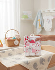 Stork And Baby 6-piece set of hooded towels and facecloths with a cute strawberry print. White cotton with red strawberries.