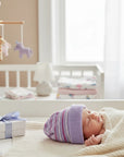 Stork And Baby purple and white striped knit baby hat with a soft comfortable fit for cold weather.