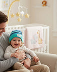 Stork And Baby striped knit winter hat in blue and teal for baby boys, featuring a soft, comfortable fit.