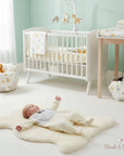 Stork And Baby light grey velour waistcoat growers with a white baby onesie and a bow tie detail
