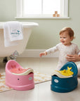 Stork And Baby pink and blue whale-shaped baby potty seats with comfortable seating for toddlers.