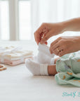 Stork And Baby white 2 pack baby socks with diamond pattern, soft and breathable cotton blend.