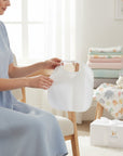 Stork And Baby white baby bib with PVC backing and tie-up closure for mess-free feeding.