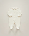 Stork And Baby white footed baby grow with silver embroidery detail on chest and collar. Cotton blend.