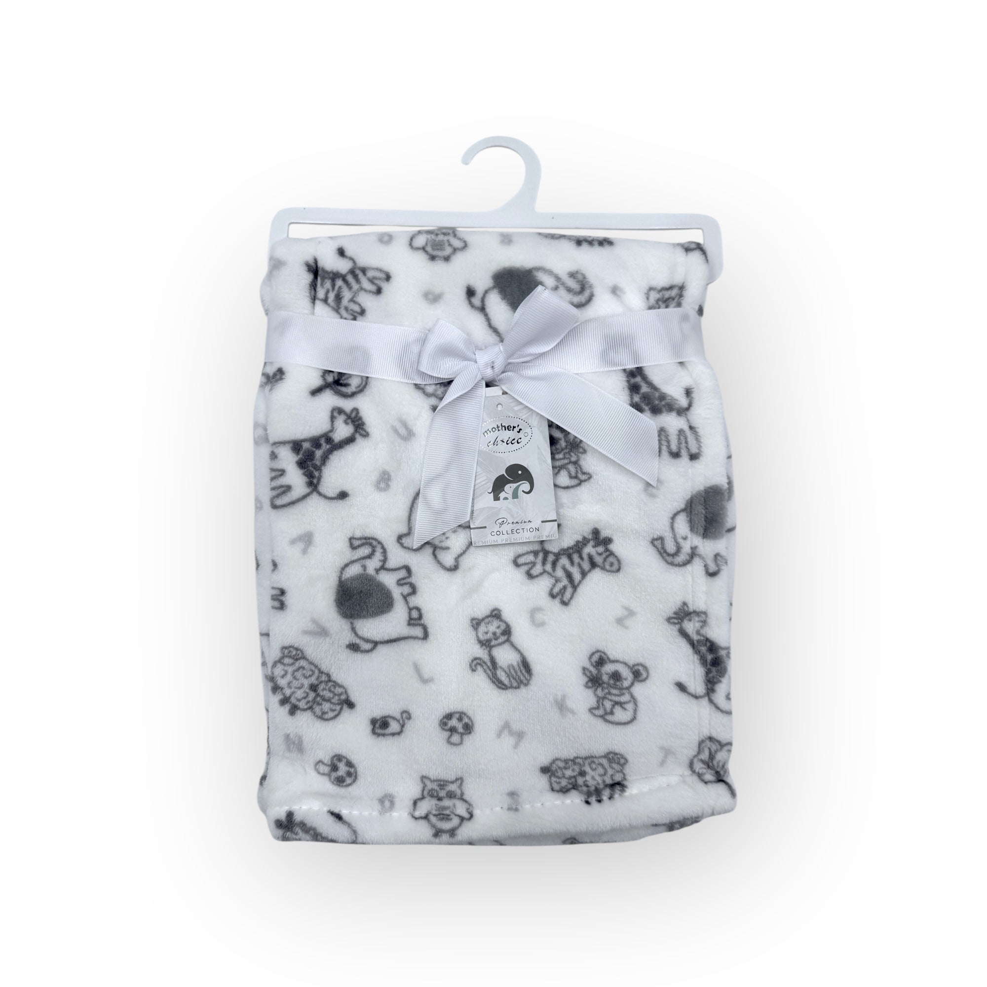 Flannel blanket with animal pattern on a hanger against a white background