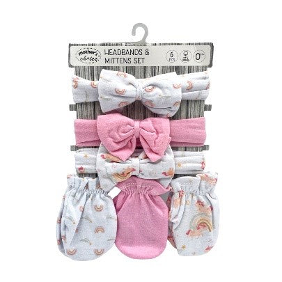 Baby headbands and mittens set with bows on a white background