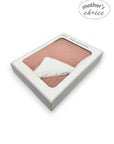 Pink baby blanket with white trim in a box labeled 'Mother's Choice' on a white background