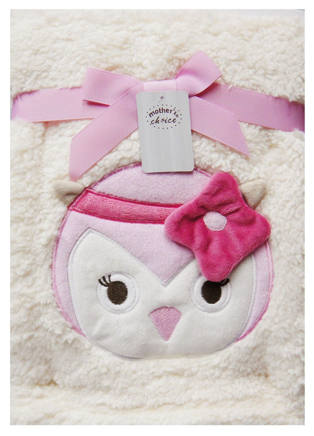 Plush owl toy with pink bow on a white blanket, branded 'Mother's Choice'.