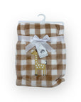 Folded checkered blanket with a white bow and tag on a white background