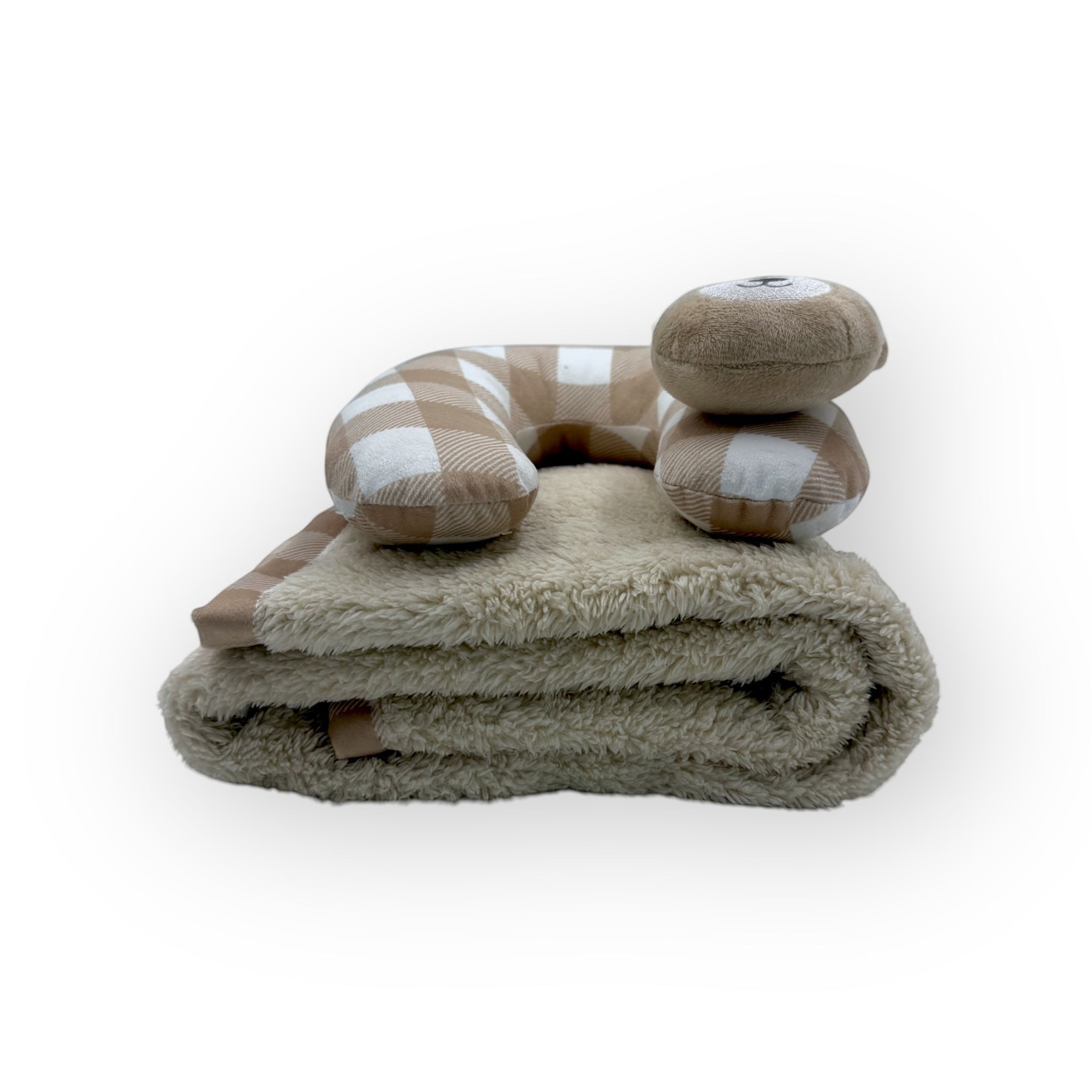 Folded blanket with checkered pillow on a white background