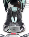 Baby car seat with a tray attached on a white background