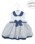 Baby dress with blue collar and bow on a white background, branded 'Mother's Choice'.